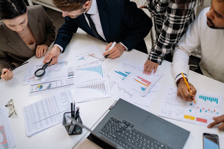 Why Are Google Ads So Expensive? Understanding the Costs and Strategies for Management 1 team meeting discussing budget allocation